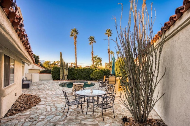 view of patio with a fenced in pool