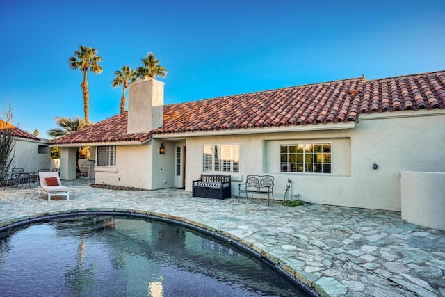 rear view of property with a patio