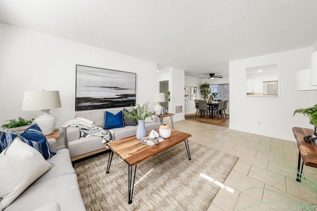 tiled living room featuring ceiling fan