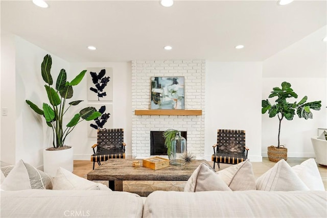 living room featuring light hardwood / wood-style floors and a fireplace