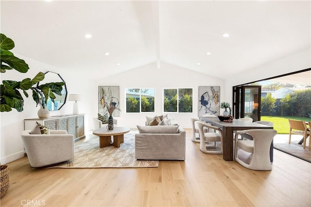 living room with light wood-type flooring and vaulted ceiling with beams