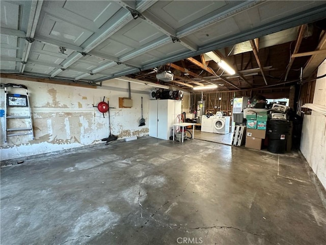 garage featuring a garage door opener and washing machine and dryer