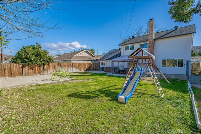 view of yard with a gazebo, a playground, and a patio