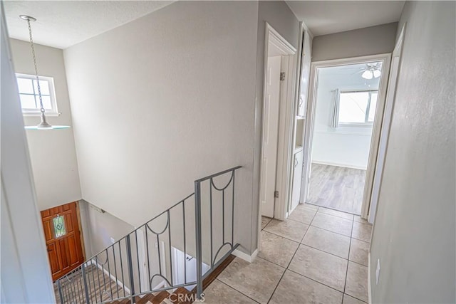 hallway with light tile patterned flooring