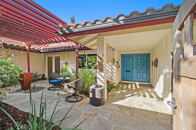 doorway to property with a patio