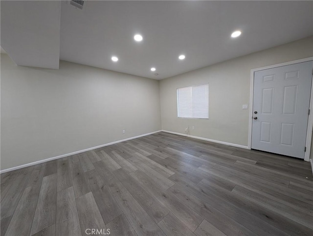 unfurnished room featuring hardwood / wood-style floors