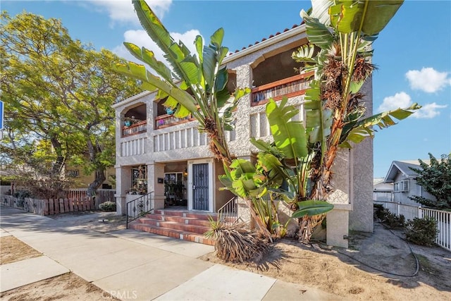 view of front of house with a balcony