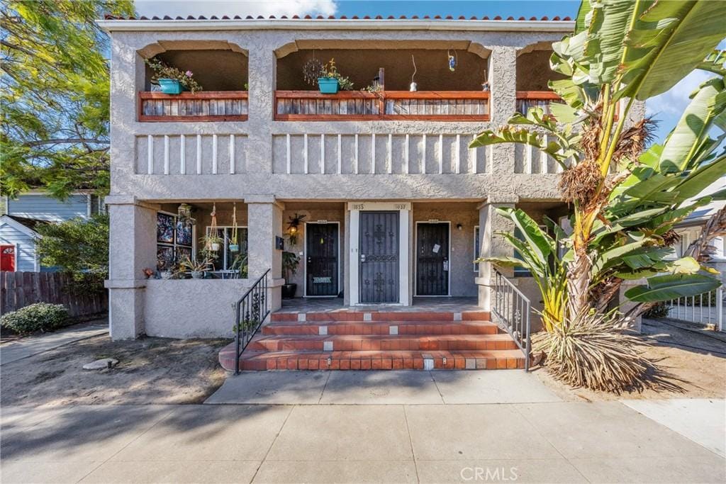 mediterranean / spanish-style house with a balcony