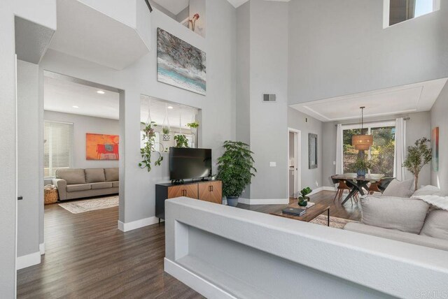 living room with dark wood-type flooring