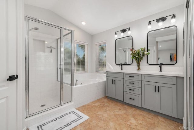 bathroom featuring separate shower and tub, tile patterned floors, vaulted ceiling, and vanity