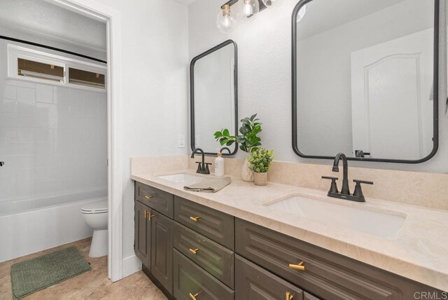 full bathroom featuring toilet, shower / tub combination, and vanity