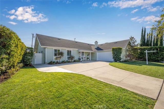 ranch-style house with a garage and a front lawn