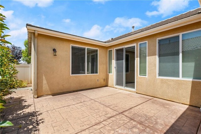 back of property with a patio area