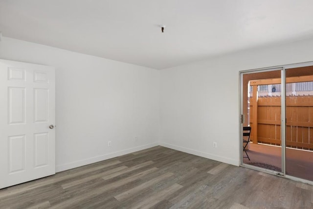 empty room featuring wood-type flooring