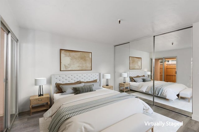 bedroom with hardwood / wood-style floors and a closet