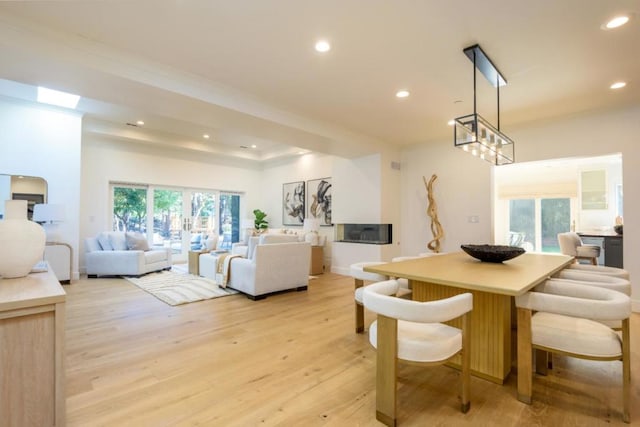 dining space with light wood-type flooring