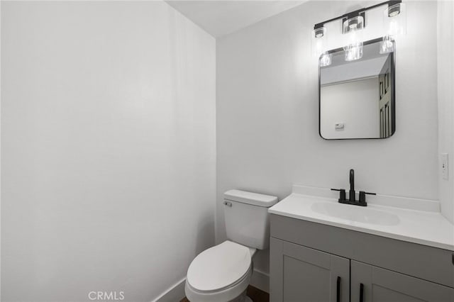 bathroom with toilet and vanity