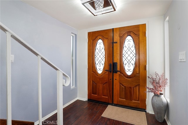 foyer entrance featuring french doors and dark hardwood / wood-style flooring