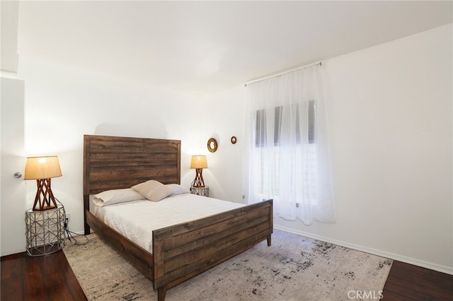 bedroom with wood-type flooring