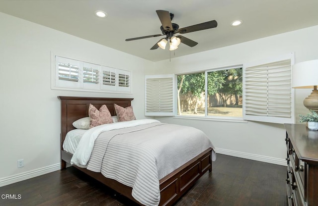 bedroom with ceiling fan and dark hardwood / wood-style flooring