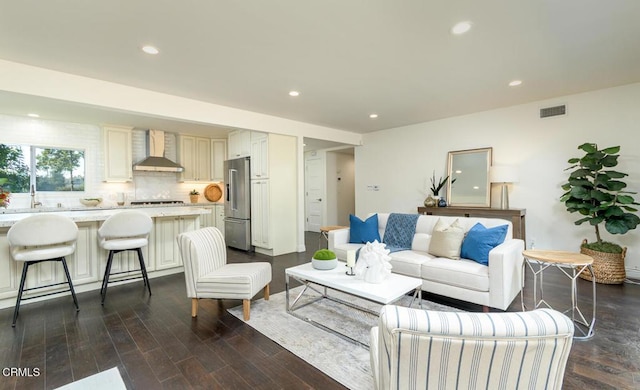 living room with dark hardwood / wood-style floors