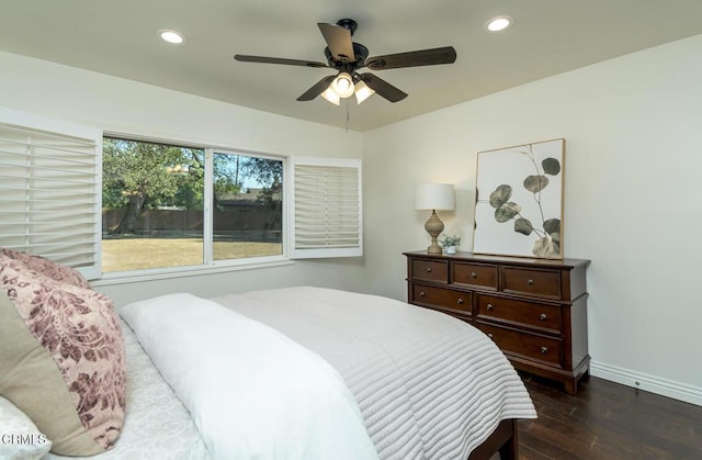 bedroom with ceiling fan and dark hardwood / wood-style floors