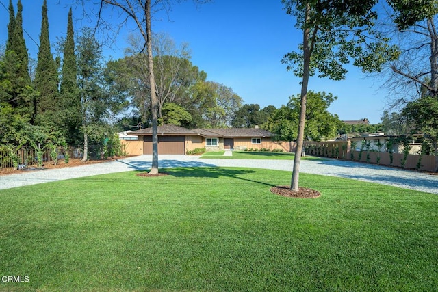 single story home with a front yard