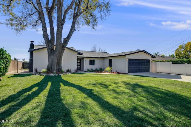 single story home featuring a garage and a front lawn