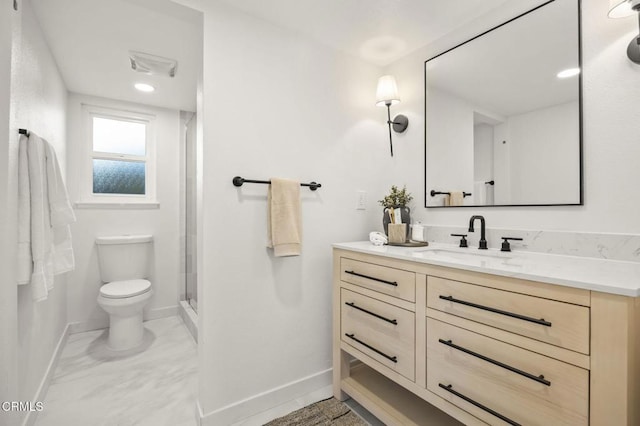 bathroom with a shower with shower door, vanity, and toilet