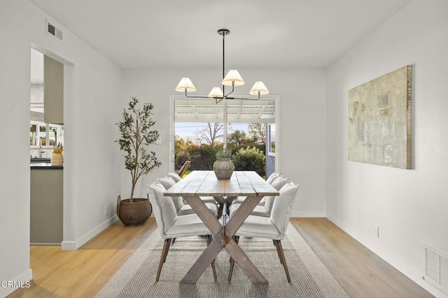 dining area featuring light hardwood / wood-style floors and sink