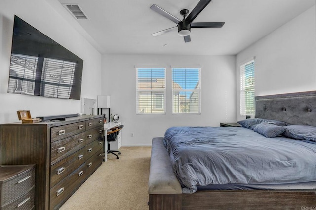 bedroom featuring ceiling fan and light carpet