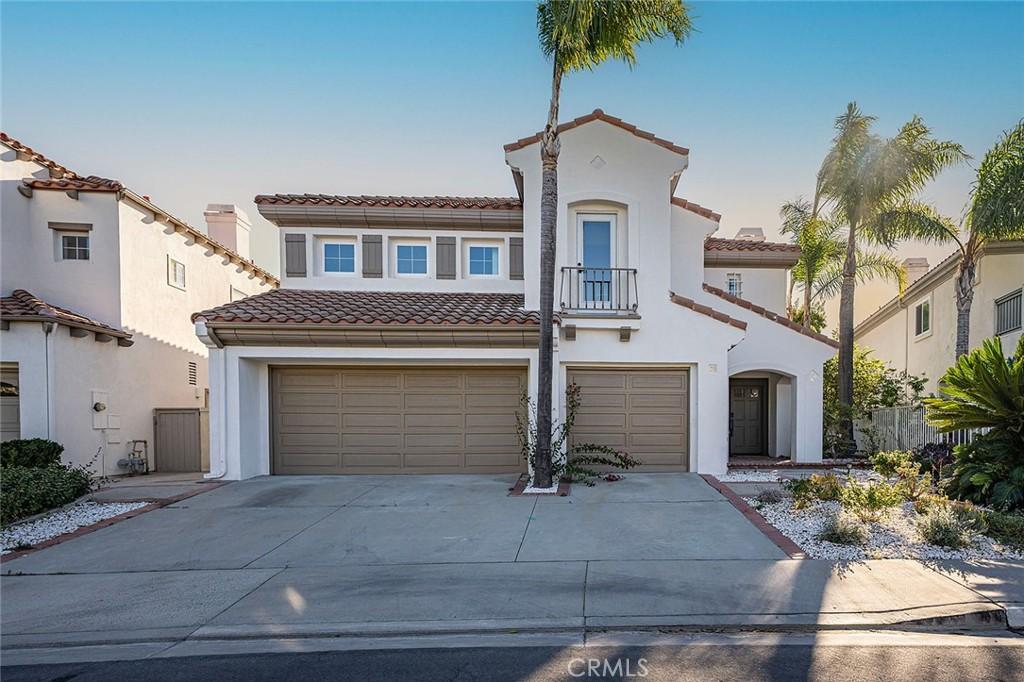 mediterranean / spanish house with a garage