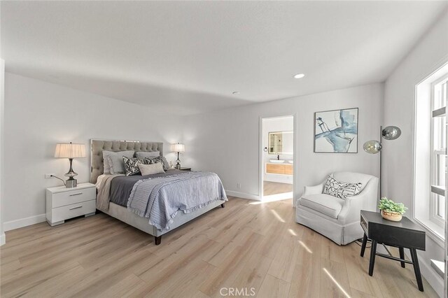 20 Flores, Lake Forest, CA 92610 - bedroom featuring ensuite bathroom and light hardwood / wood-style flooring
