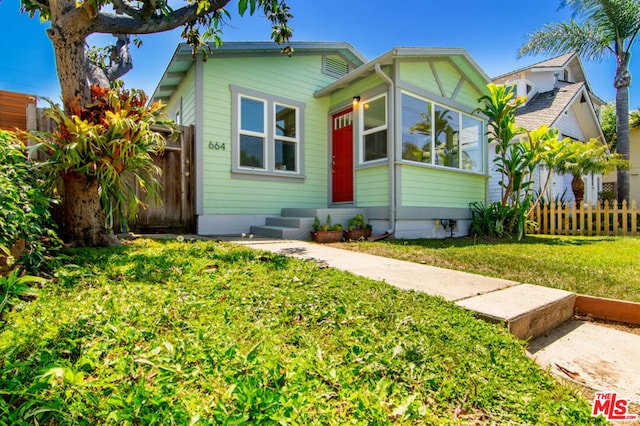 view of front of home with a front yard