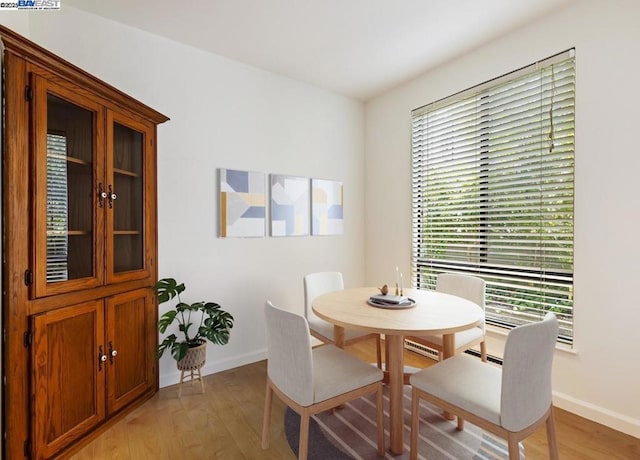 dining space with light wood-type flooring