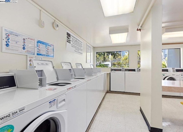 laundry area featuring washer and clothes dryer and plenty of natural light