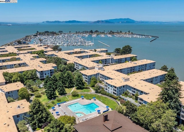 bird's eye view with a water and mountain view