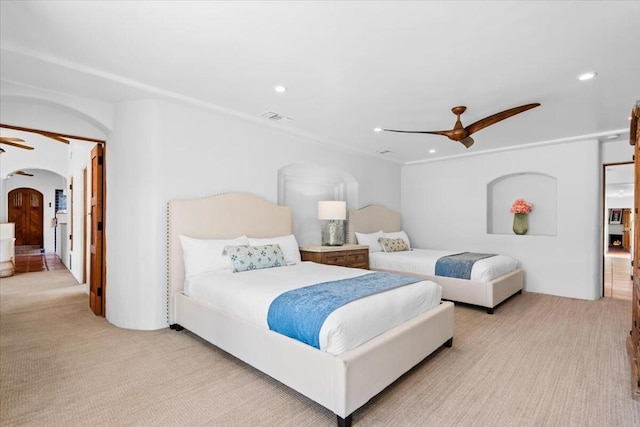 carpeted bedroom with ceiling fan