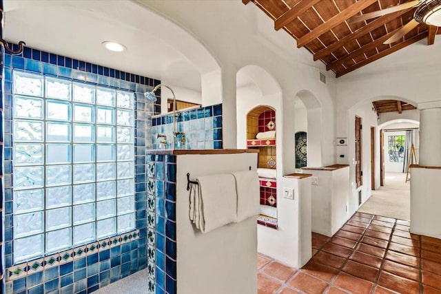 kitchen with vaulted ceiling with beams and wood ceiling