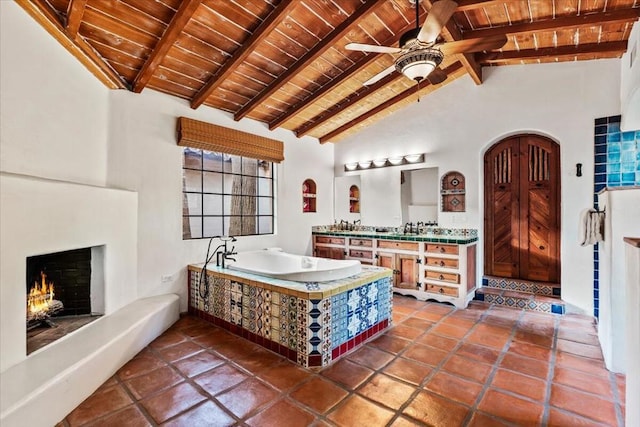 interior space with wood ceiling, ceiling fan, sink, high vaulted ceiling, and beam ceiling