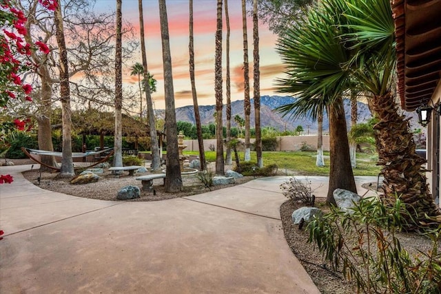 view of home's community with a patio area and a mountain view