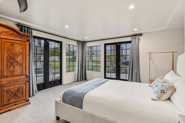 carpeted bedroom featuring access to exterior and french doors