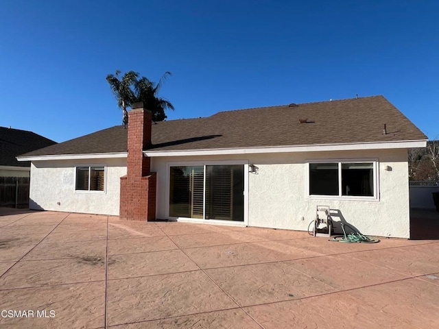 back of property featuring a patio area