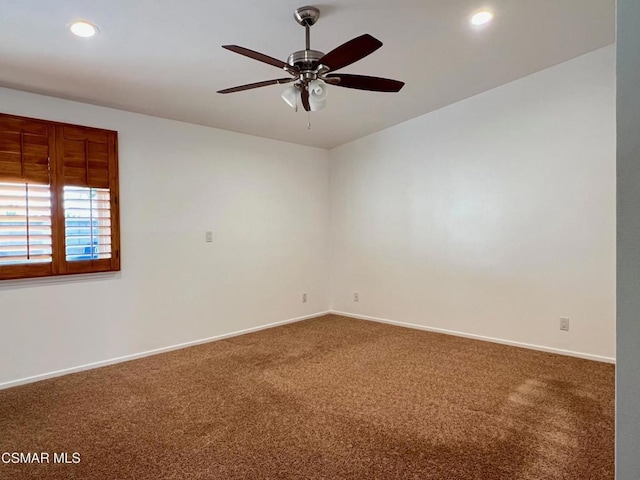 unfurnished room featuring carpet and ceiling fan