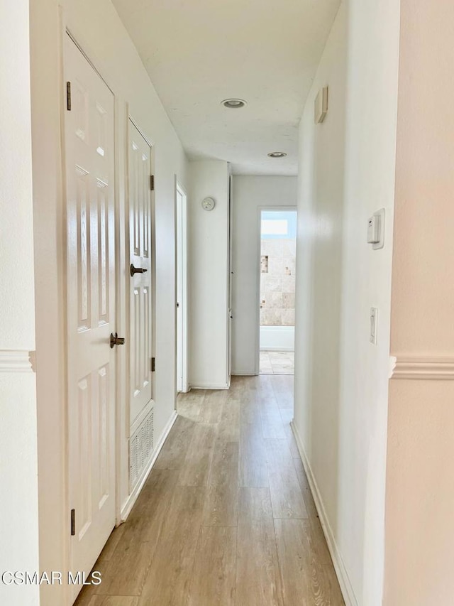 corridor featuring light hardwood / wood-style flooring