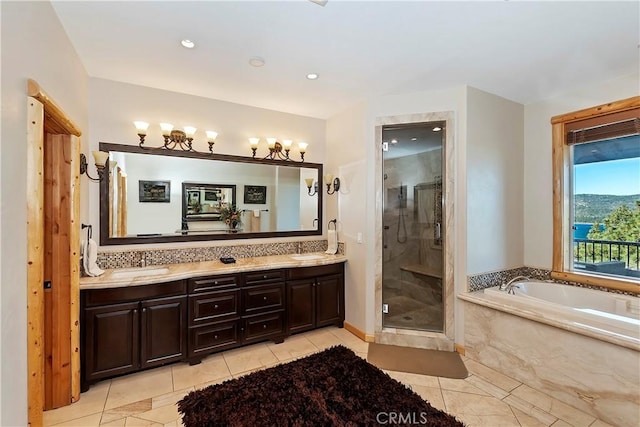 bathroom featuring backsplash, tile patterned floors, vanity, and shower with separate bathtub