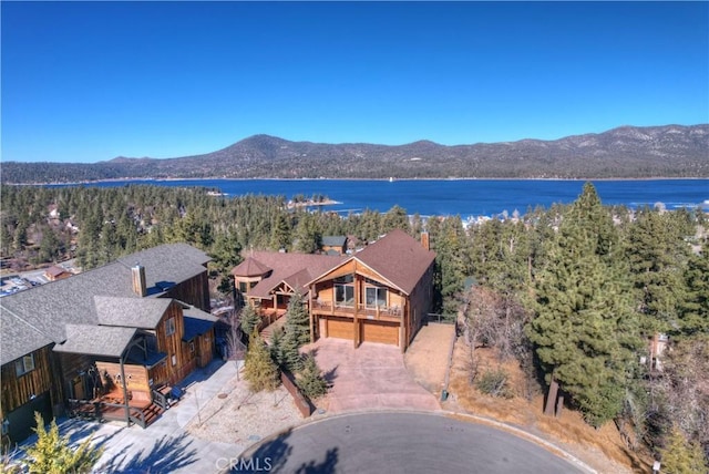 bird's eye view with a water and mountain view