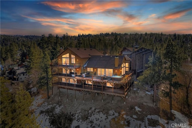 view of back house at dusk