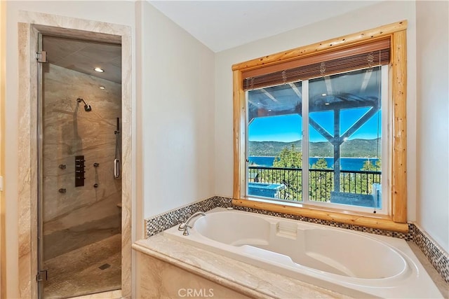 bathroom with plus walk in shower and a mountain view