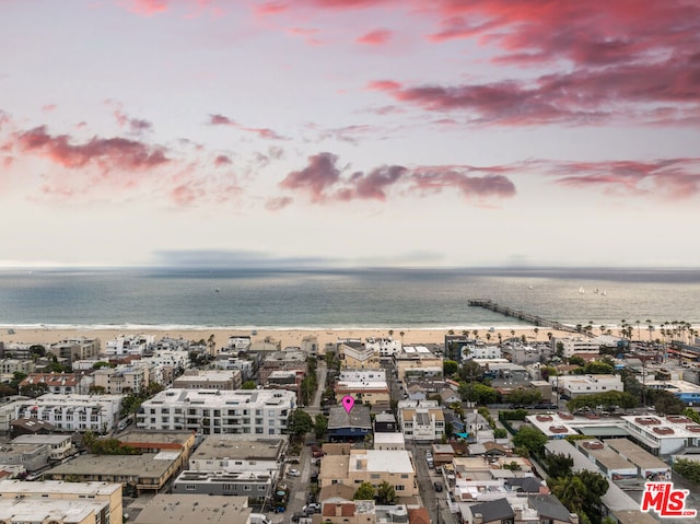 aerial view at dusk with a water view